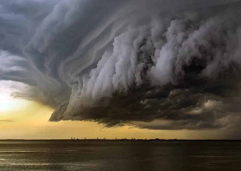 Shelf cloud of a storm front rolling over the sea