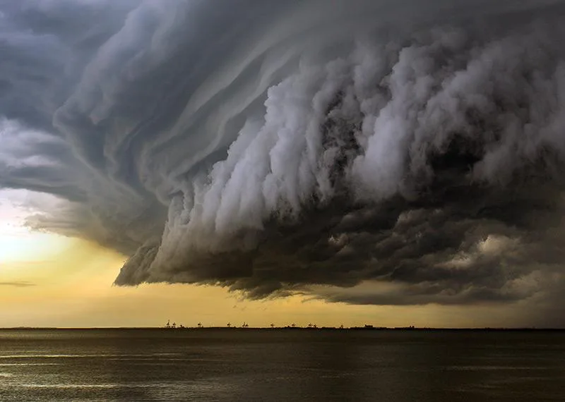 Shelf cloud of a storm front rolling over the sea