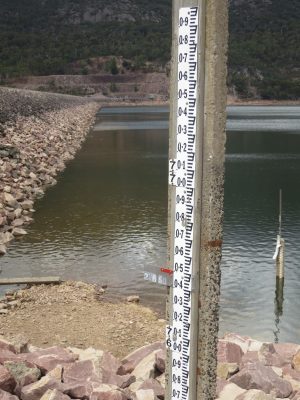 Several staff gauges indicating water level at dam near Halls Gap